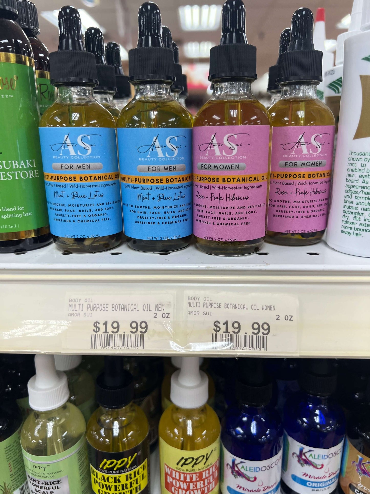 Multi-purpose botanical oil bottles for men and women on store shelf, promoting natural skincare and revitalizing benefits.