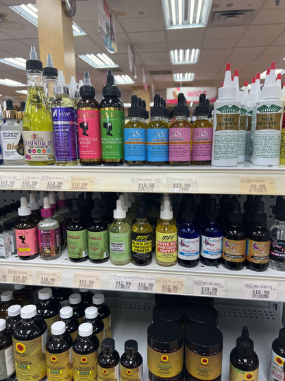 Shelves stocked with various essential oils and botanical oils for natural skincare and hair care products.